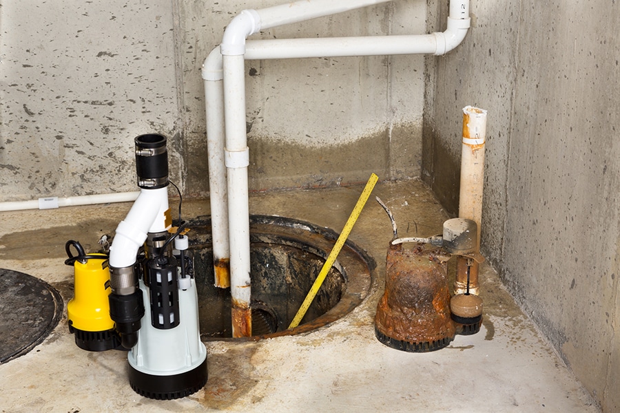 Sump pump with rust is replaced with a new model.