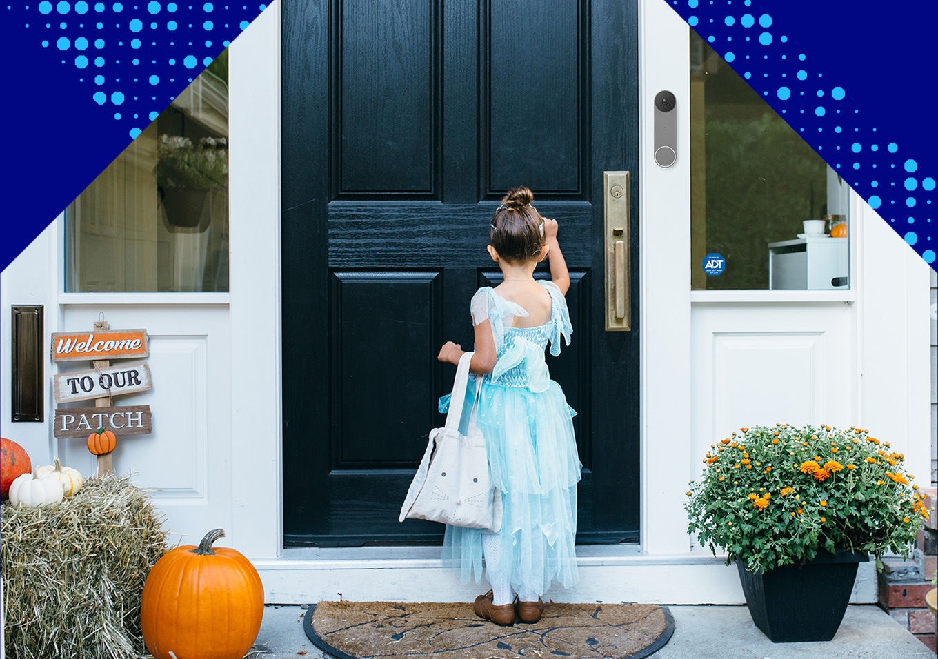 Little girl trick or treating in front of an ADT protected home