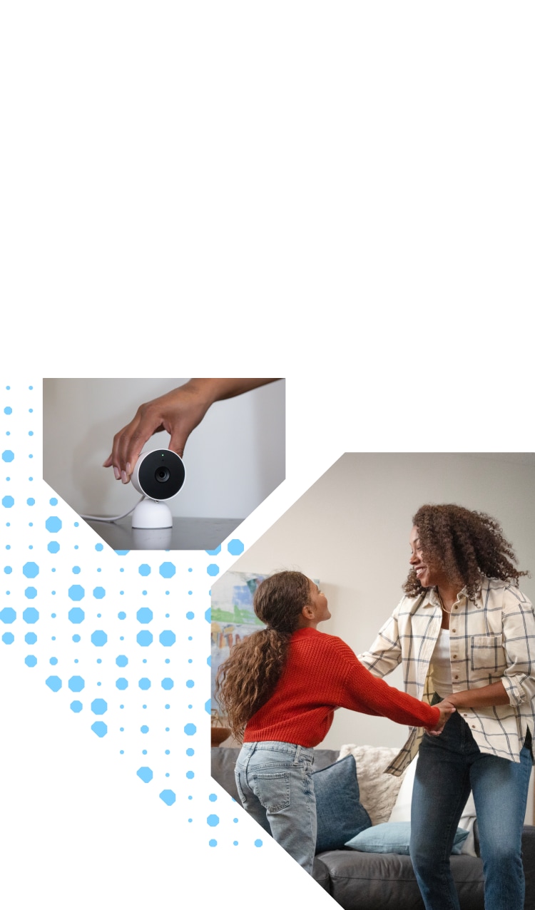 Mother and daughter holding hands with a Google Nest Indoor Camera in the room