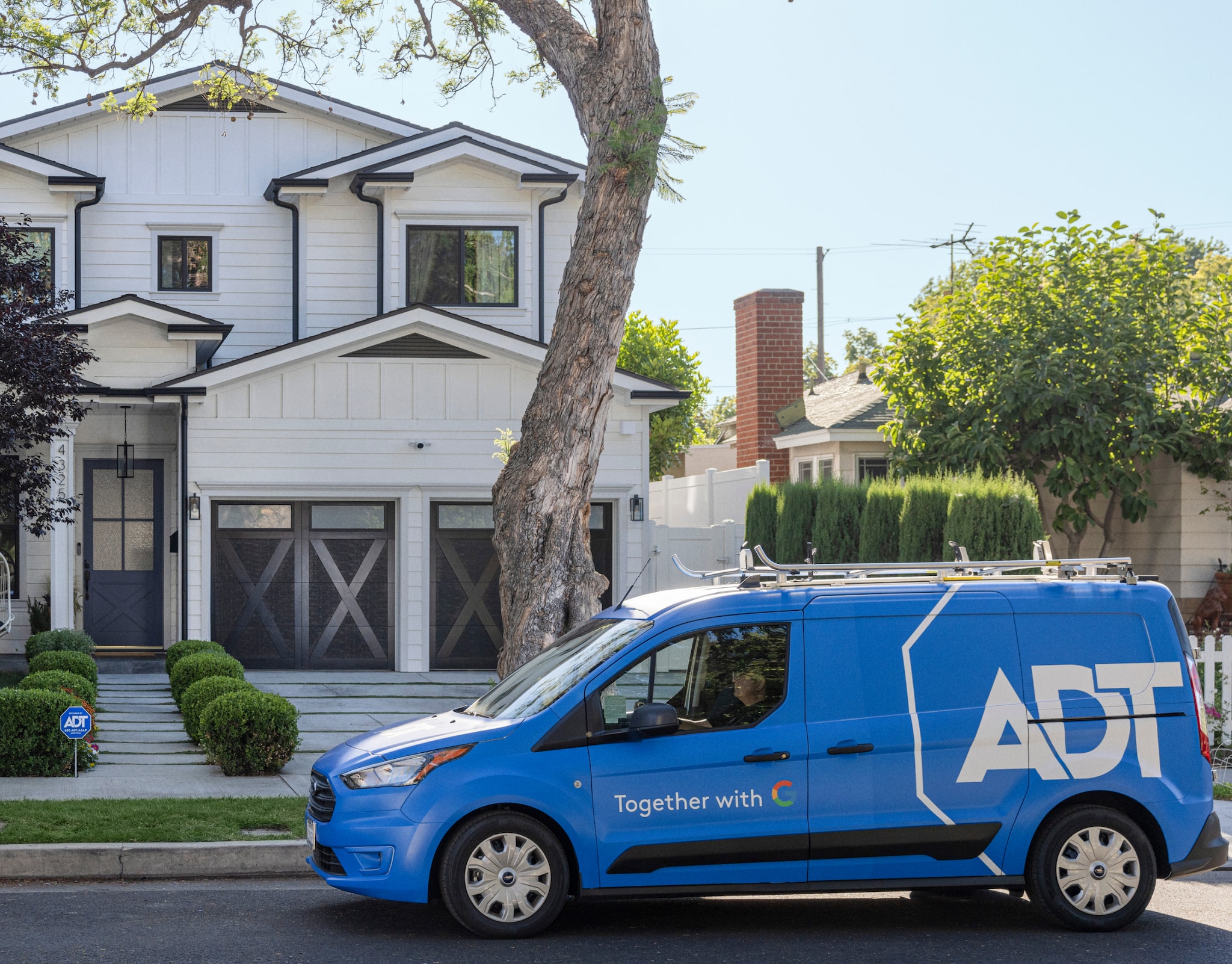 ADT van outside of someone's house