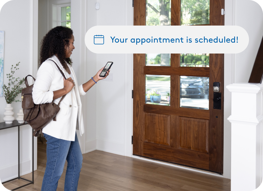 An ADT customer scheduling an ADT installation on her cell phone 