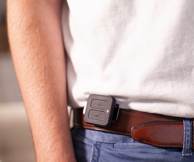 A portable ADT panic button device clipped onto the belt of a person wearing business-casual clothes. A portable ADT panic button device clipped onto the belt of a person wearing business-casual clothes.