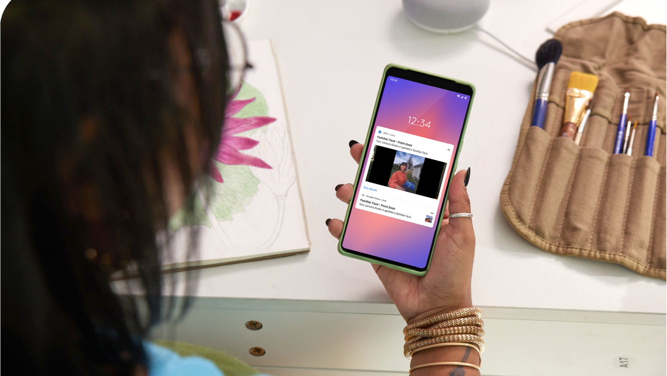 Woman using ADT+ app on cell phone Woman using ADT+ app on cell phone