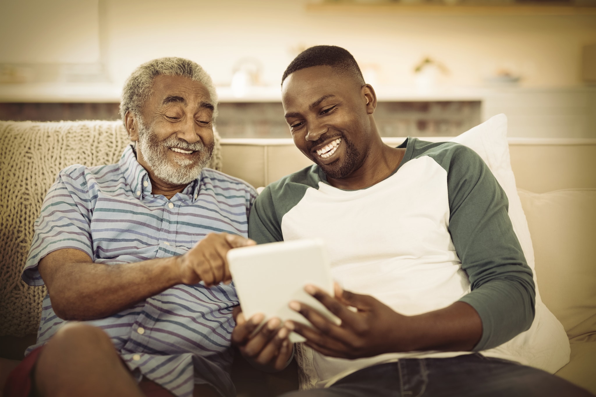 Grandson & Grandparent sitting together laughing