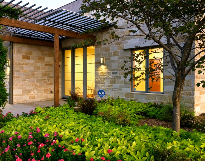 ADT sign in front of a house ADT sign in front of a house