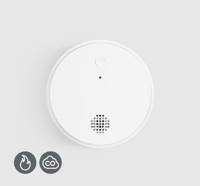 Smoke & Carbon Monoxide Detector on a grey background