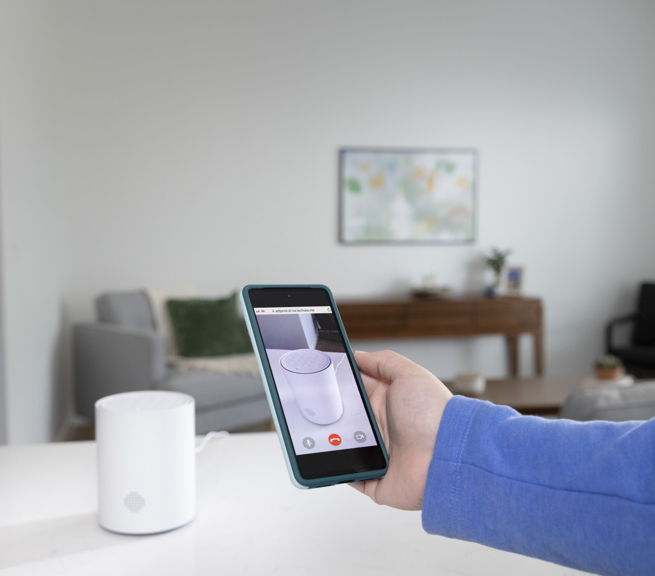 Someone using the ADT+ app to set up the ADT Base Someone using the ADT+ app to set up the ADT Base