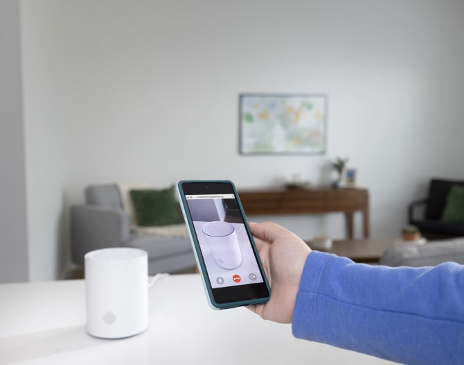 Someone using the ADT+ app to set up the ADT Base Someone using the ADT+ app to set up the ADT Base