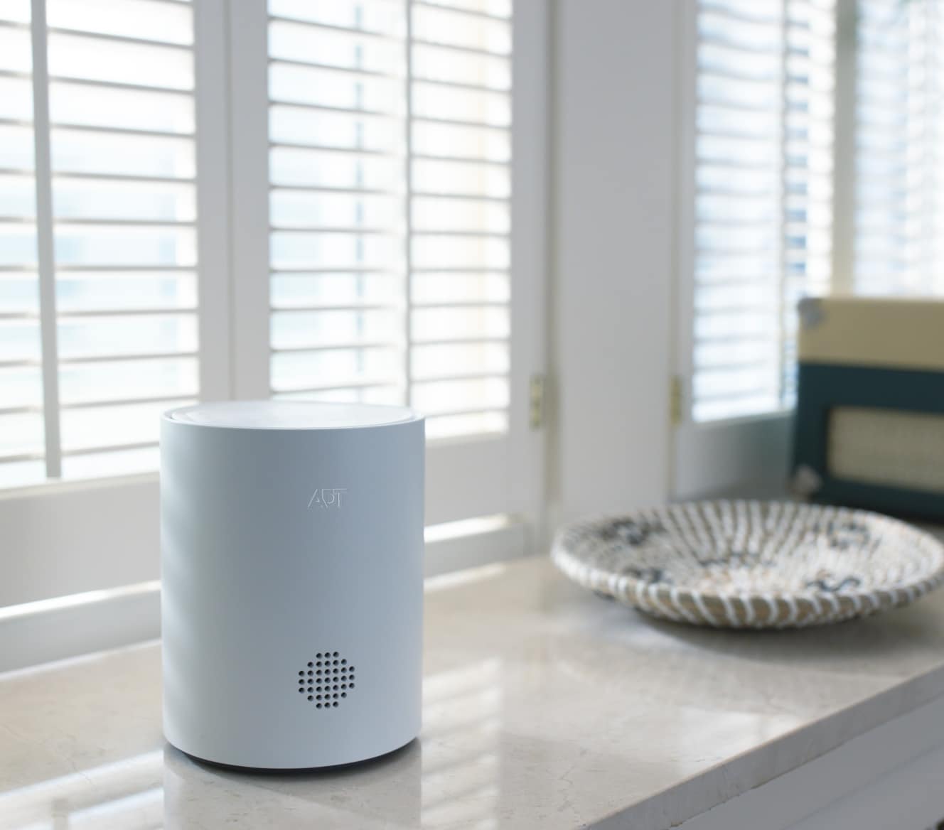 ADT Base on the shelf under a window ADT Base on the shelf under a window