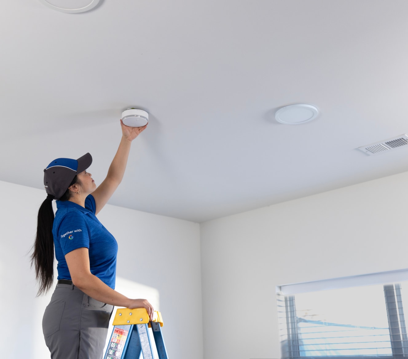 ADT technician installs ADT Smoke and Carbon Monoxide Detector