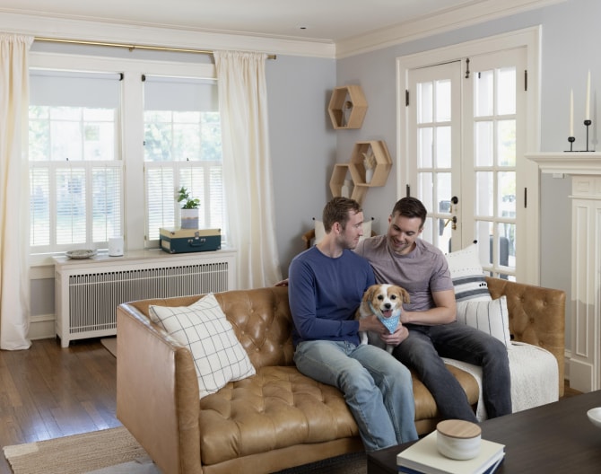 Couple with dog on couch 