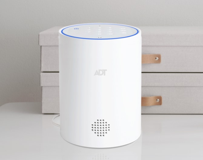 ADT Smart Home Hub on a table with drawers behind it