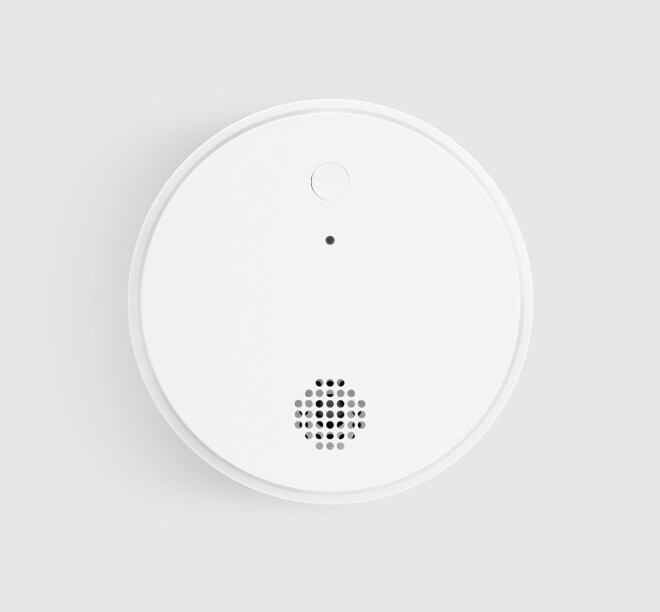 ADT Smoke Detector on a grey background ADT Smoke Detector on a grey background
